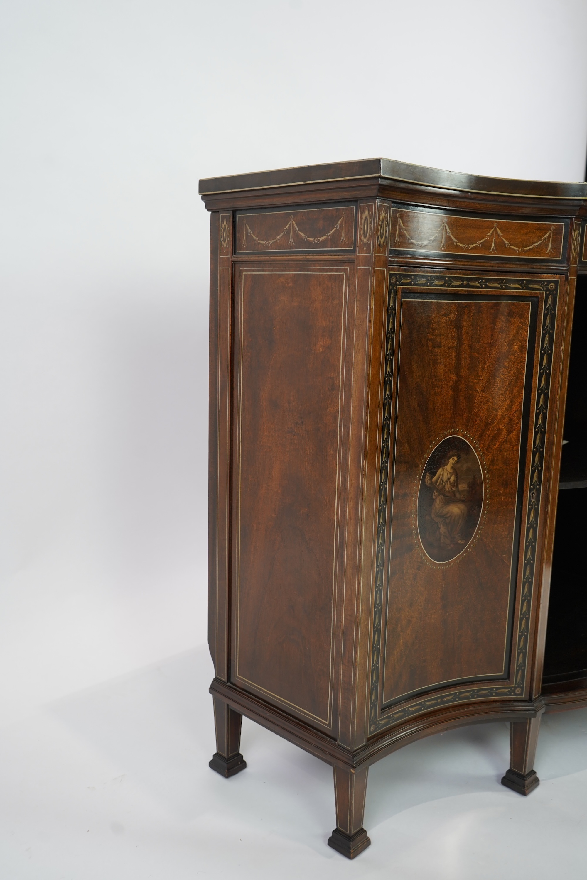 An Edwardian Sheraton Revival painted mahogany bowfront side cabinet